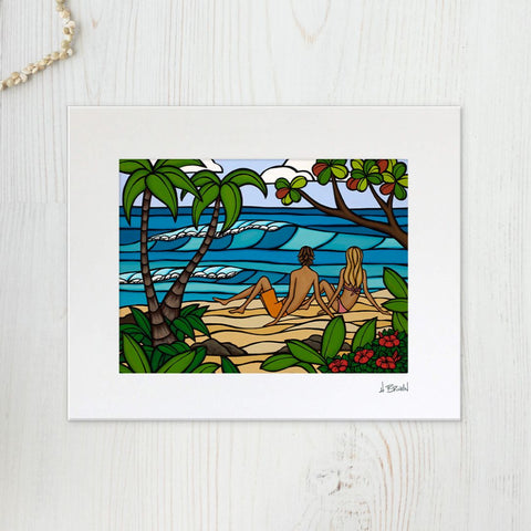 Heather Brown's 'Island Romance' print featuring A tropical paradise with waves and flowers and a happy couple sitting on the beach