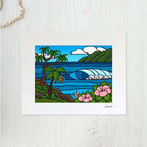 matted print of surf artist heather brown painting showing breaking waves, pink hibiscus flower, banana tree and green mountains in the background