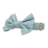 light blue dog collar with bow tie with white squiggle print