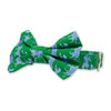 dog collar with bow tie in a print featuring blue leopards on a green background
