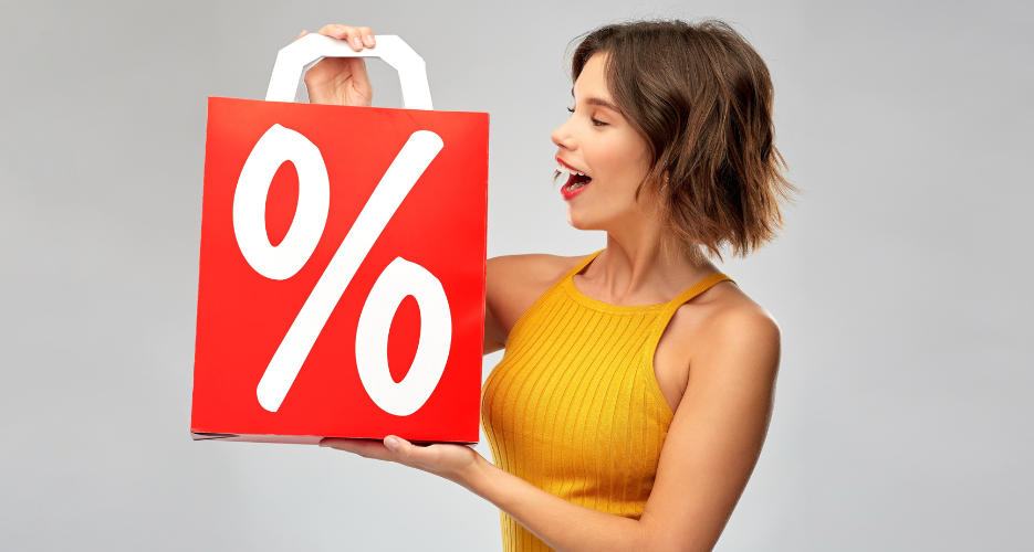 woman holding discount sign