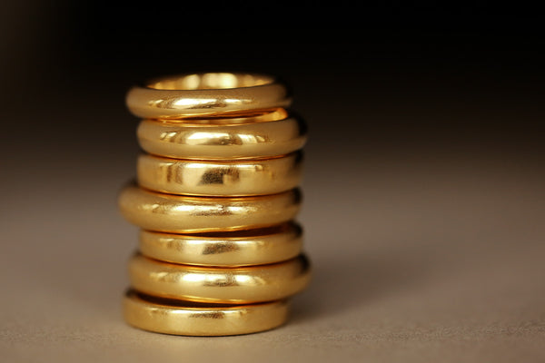 stack of 18k yellow gold rings by george rings
