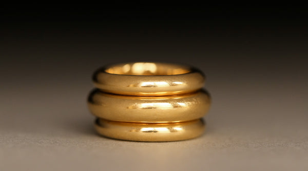Solid 18k gold stack of donut rings by George Rings