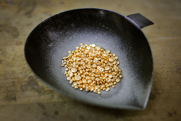 Bowl of 18k gold casting grains