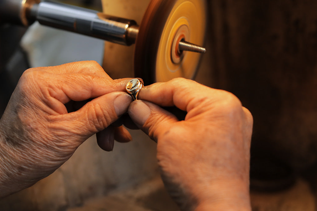 final polish of button ring grande by george rings lost wax casting