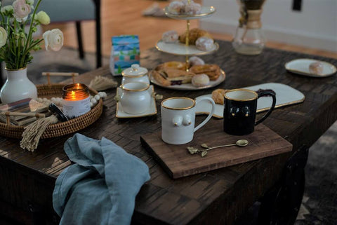 Black and white boobie mugs sitting on tea tray