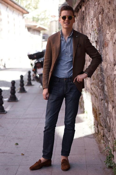 Classic navy blazer, blue jeans, and brown shoes combo