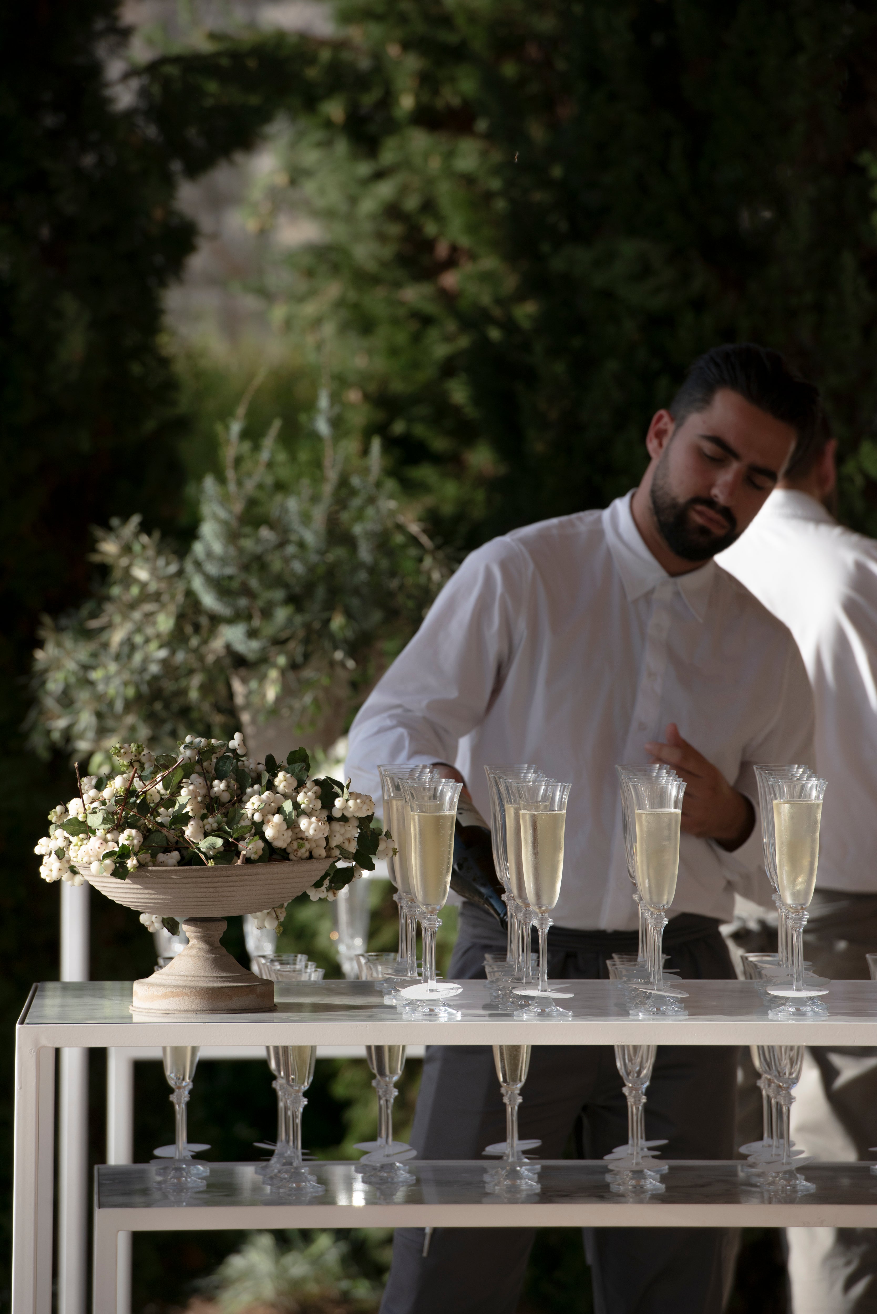 service staff pouring champagne