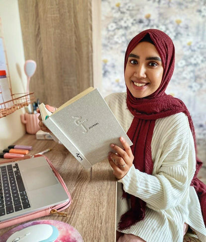 Nafisa Insan Jeem Brand Ambassador holding a Jeem Journal