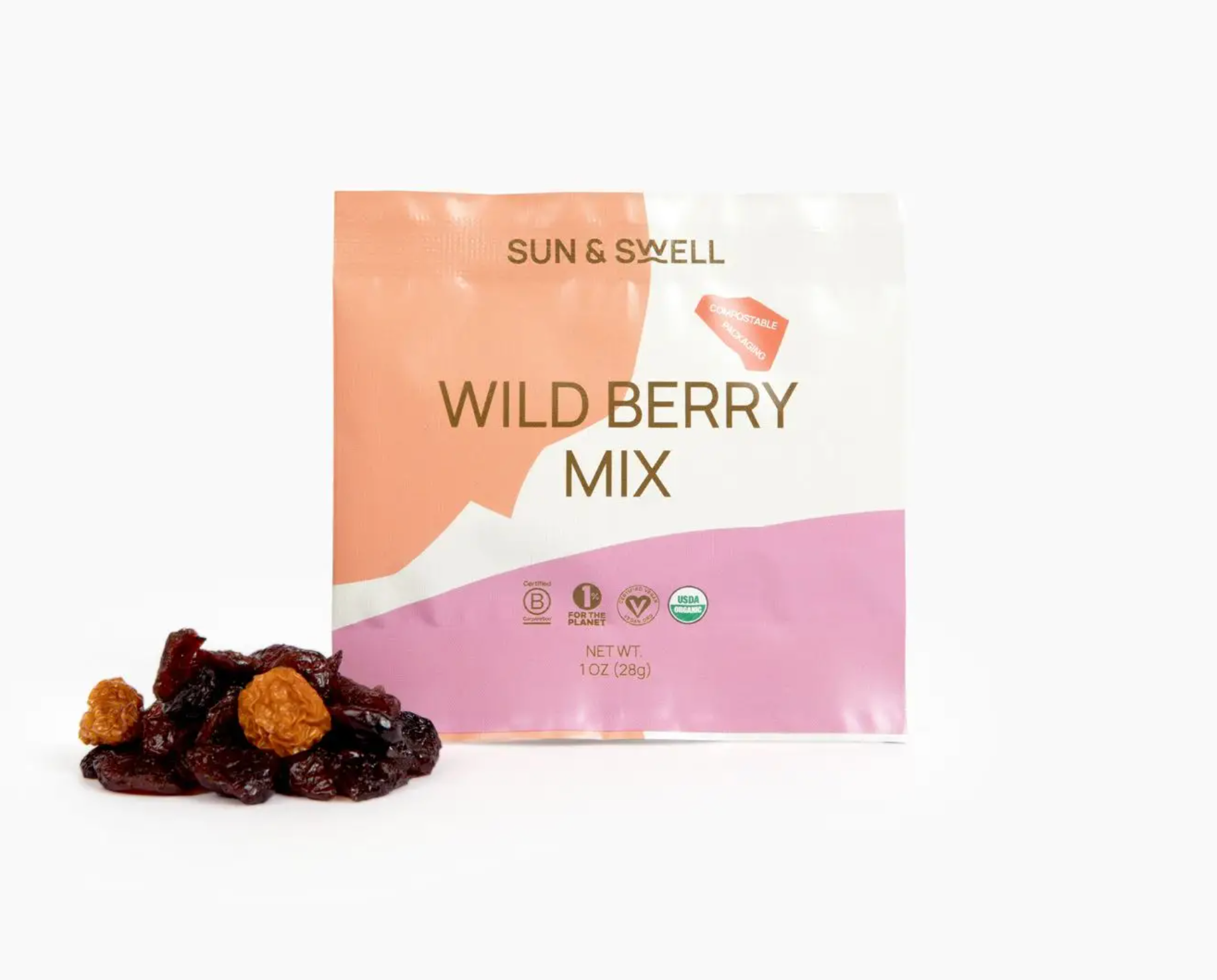 Small pouch of wild berry dried berries with a small pile of dried berries beside it