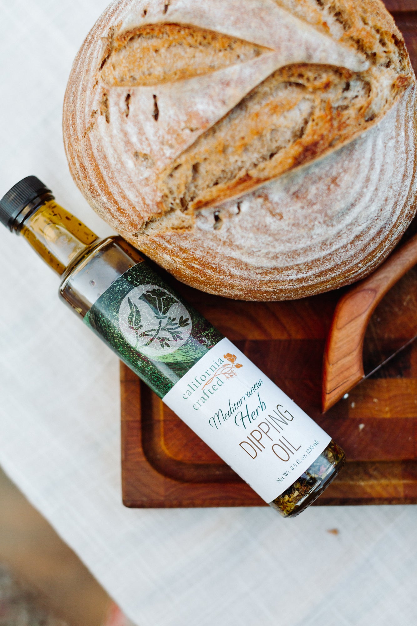 California crafted Mediterranean herb dipping oil alongside rustic baked bread.