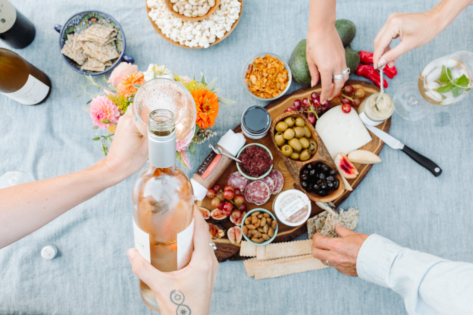 Soirée dinner party spread on an elegant tablecloth.