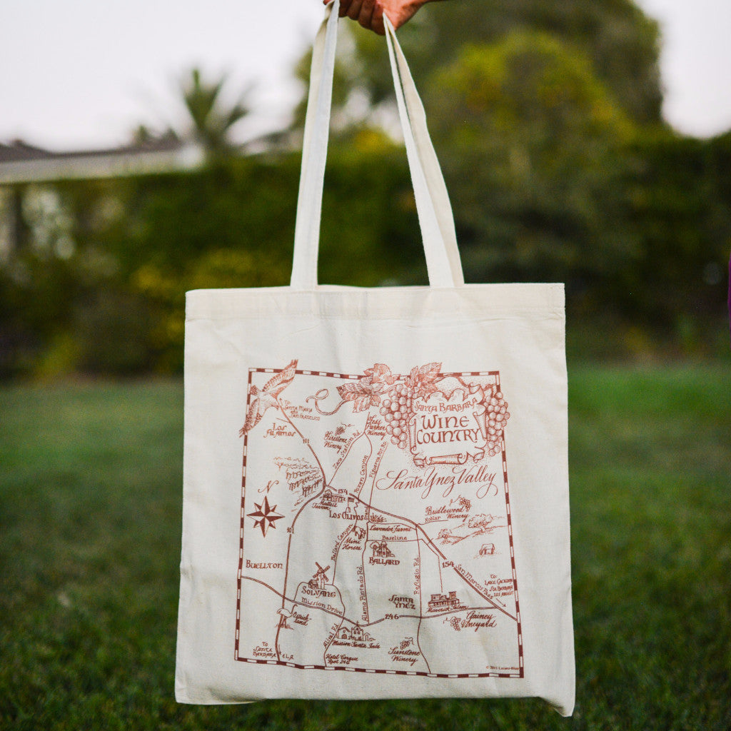 tote held up outside with brown illustrated map of Santa Barbara wine country