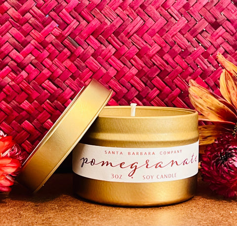 Pomegranate Travel Candle against autumn background, The Santa Barbara Company