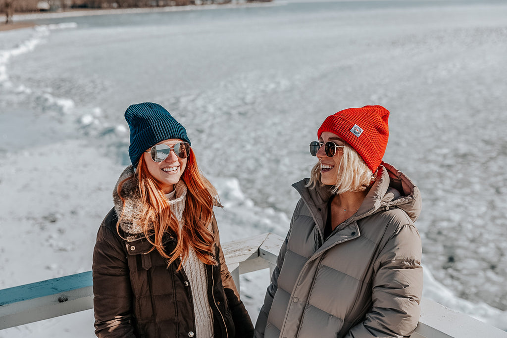 two girls wearing beanies in the winter