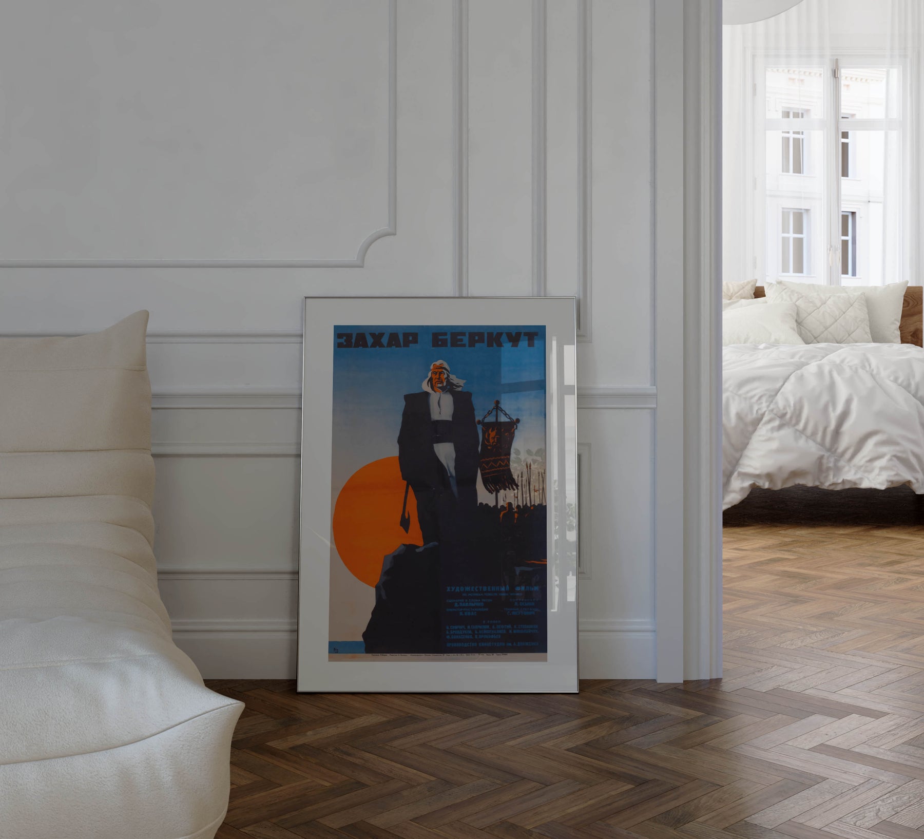 The Rising Hawk – Russian SFSR war movie poster from 1972 by I, Burov featuring a warrior, ships, and contrasting orange and blue, framed in a French apartment with parquet floors, white walls and soft sunlight