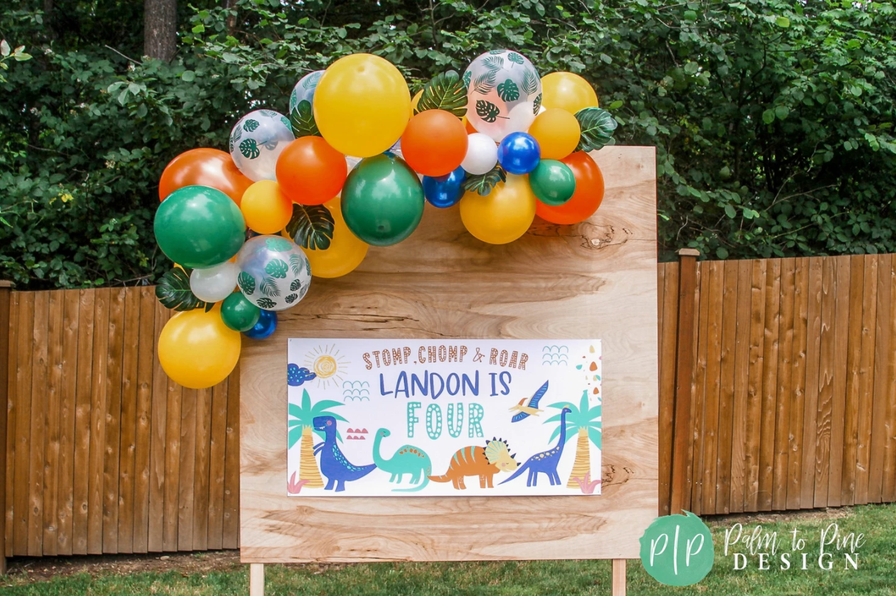 dinosaur birthday banner and balloon garland