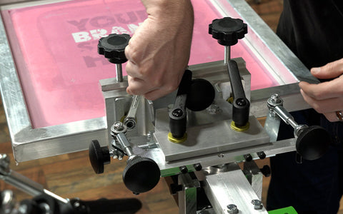 a hand adjusts the off contact with a wrench on the Riley Hopkins 250 press