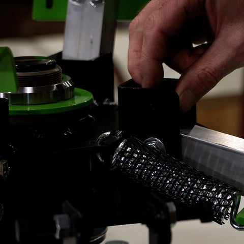 hand installing safety bumper on press