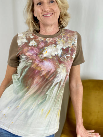 woman wearing a brown t-shirt with painterly front panel