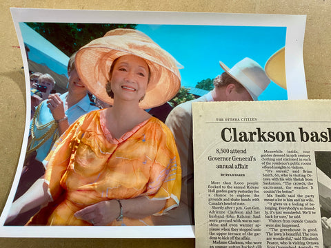 lady in an orange dress with hat