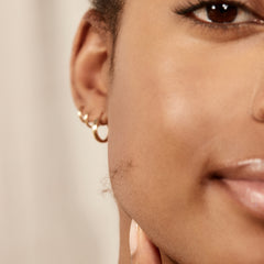 Image of model smiling with a line of vellus hair on her cheek