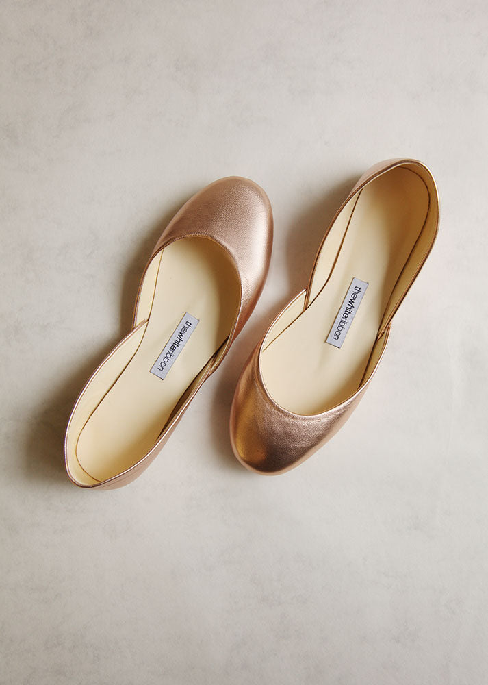 white and gold flats