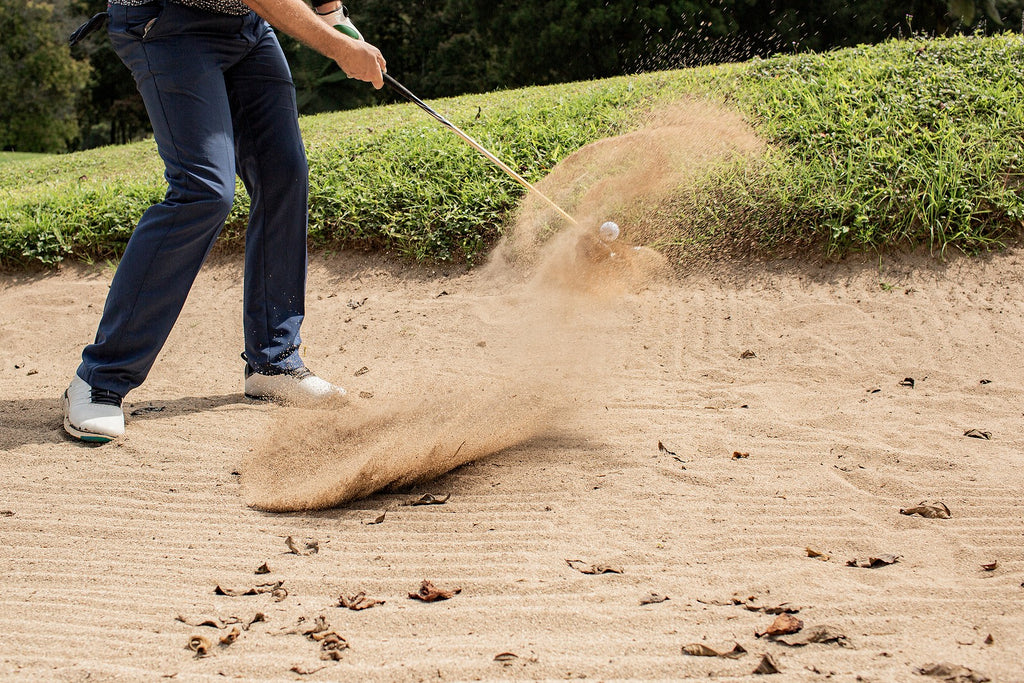 man-golfing-from-sand-trap