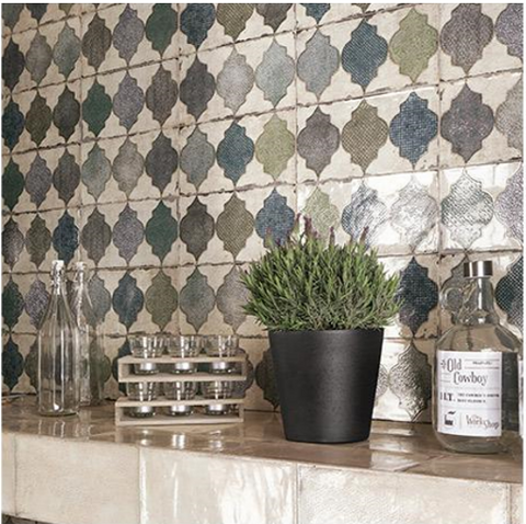 15x30cm Venice Decor tile wall in kitchen setting with glass bottle and plant on a neutral glazed tiled shelf
