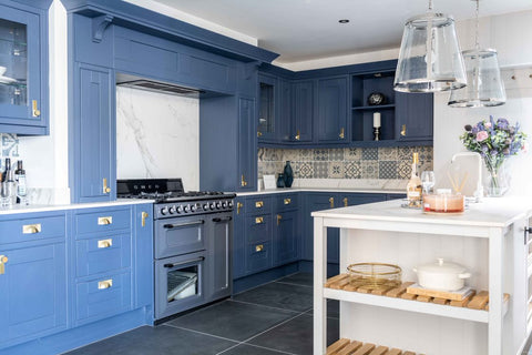 20x20cm Antiqua mix pattern tile set in a royal blue kitchen with black range cooker and white work surfaces