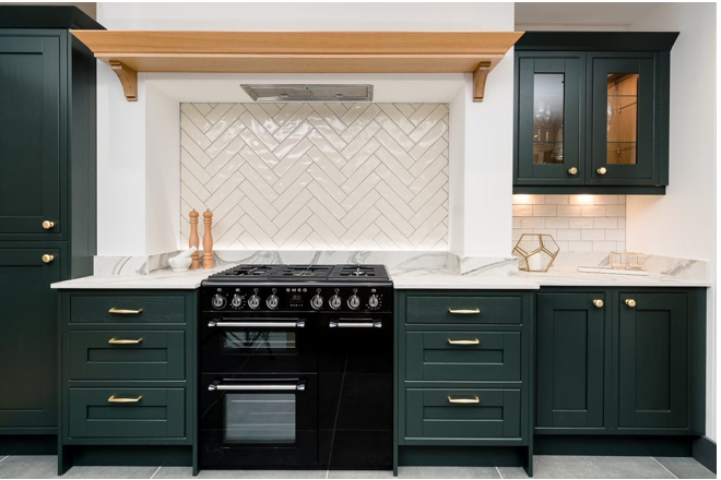 deep green kitchen cabinets with black oven, white gloss tiled wall and splashback and grey tiled floor