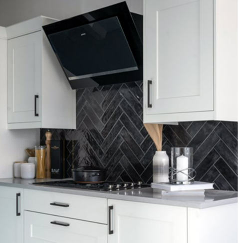 Nissel black wall tile as a kitchen splash back with white kitchen units