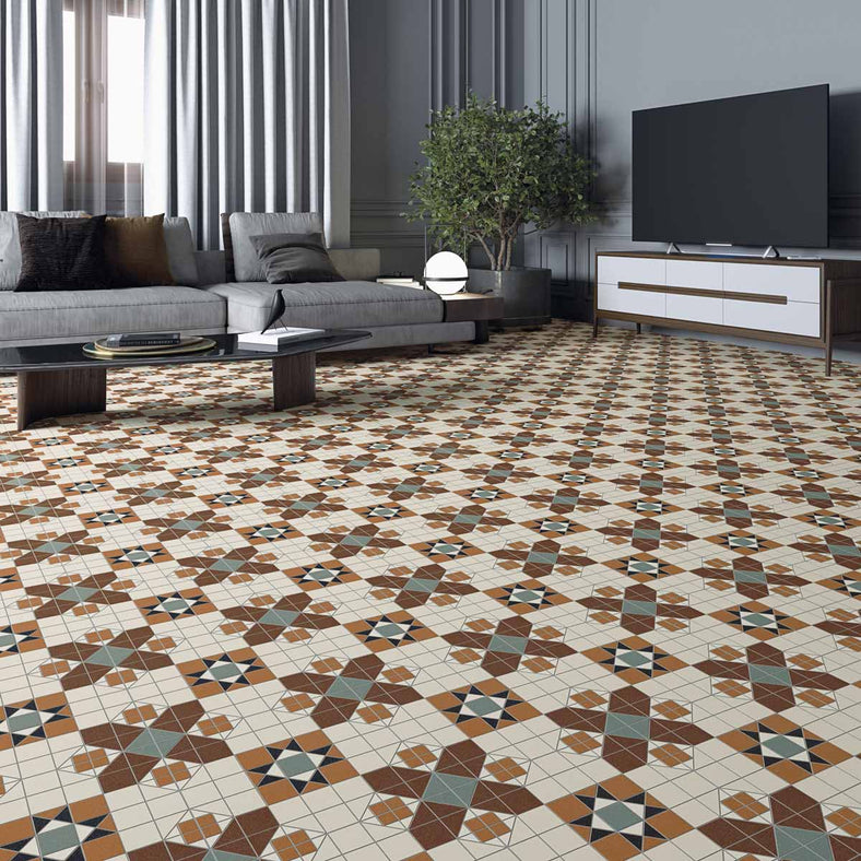 Blakeney Patterned floor tiles 31.6x31.6c0m. Victorian floor tiles in a lounge setting. Grey decor including curtains and sofas. Mosaic tiles in a close up shot with sofas, tv and tv stand in the background.