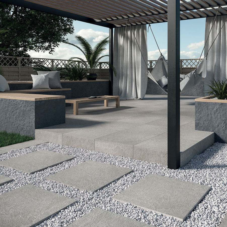 Outdoor Porcelain tile 60x90cm Natural stone Anthracite in a raised seating area with a canopy, , hammock and bench style seating