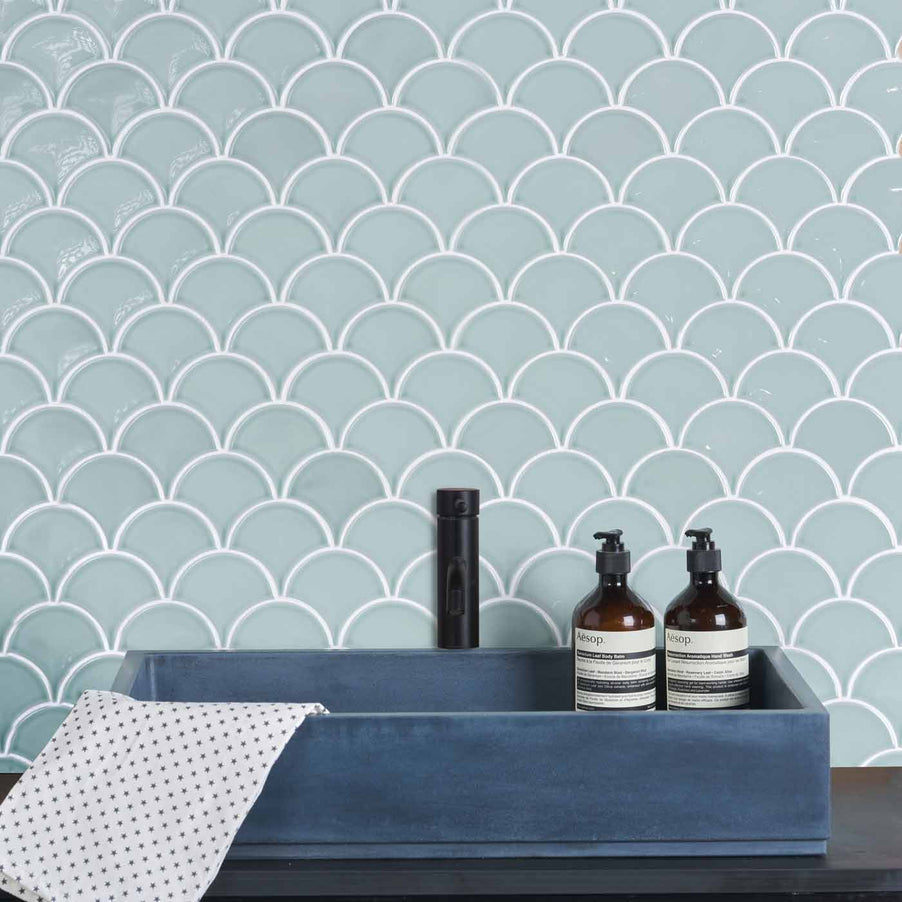 Gelato Mint Scallop tiles 25.9x27.3cm as bathroom tiles ideas and bathroom wall tiles with a blue rectangular sink featuring bathroom bottles