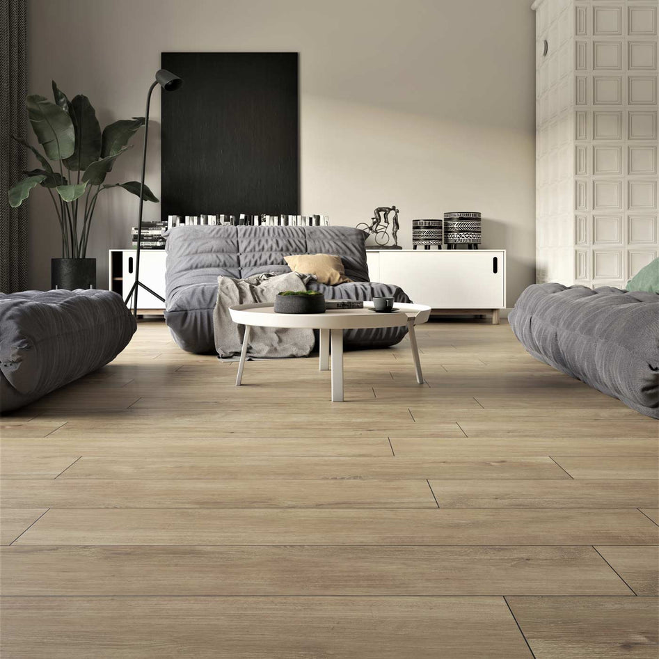 15.5x62cm Nordic Beige Wood Plank tile in living room setting with grey sofa and hygge furniture