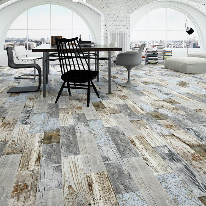 Sea Breeze Wood tile 15x60cm in a penthouse flat setting with white sofas and a dining room table and chairs.