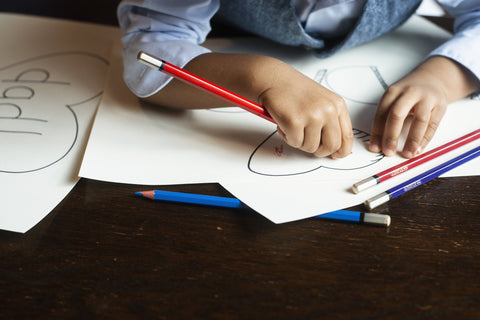 kids-coloring-on-notebook