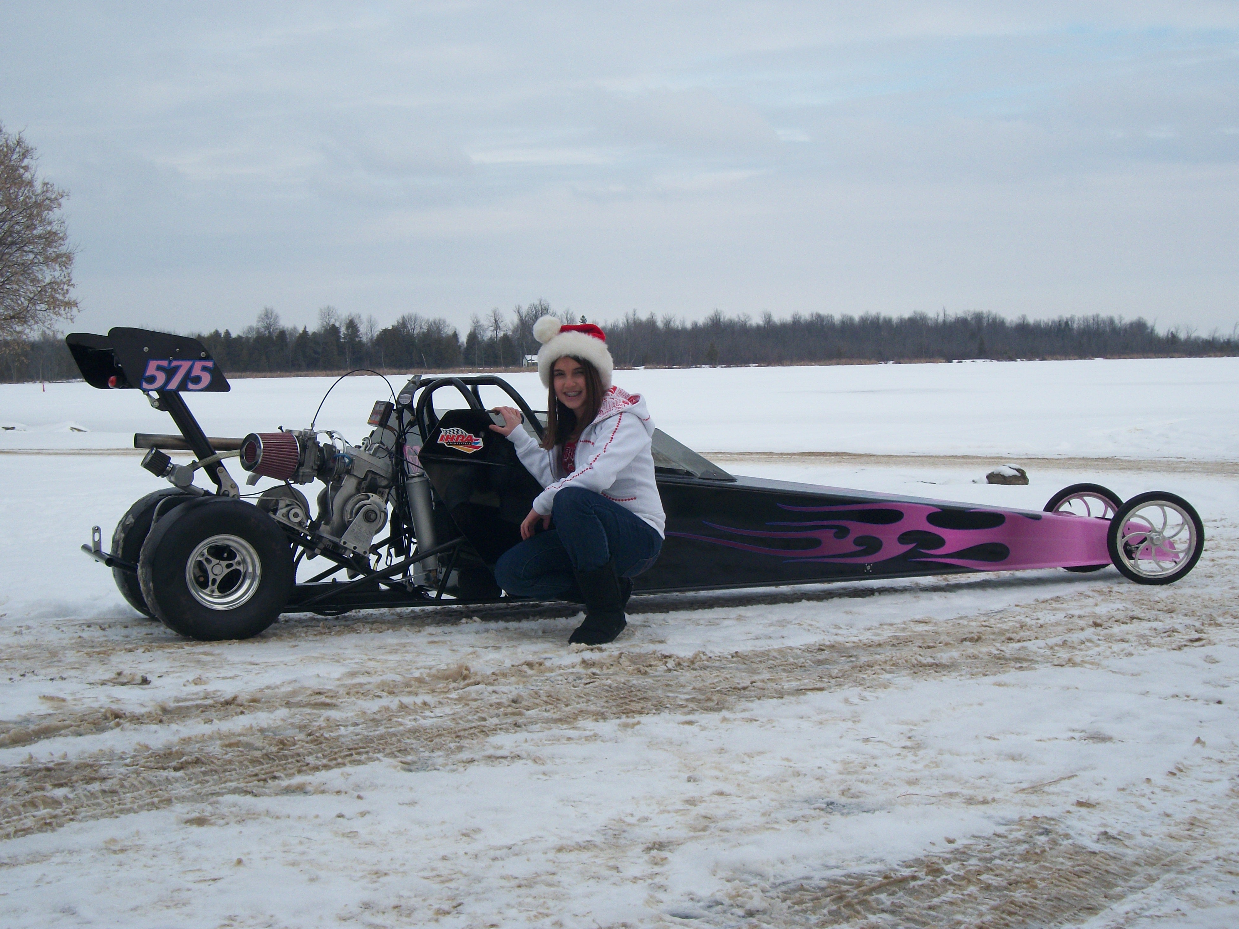 rachel kneeling beside her junior dragster