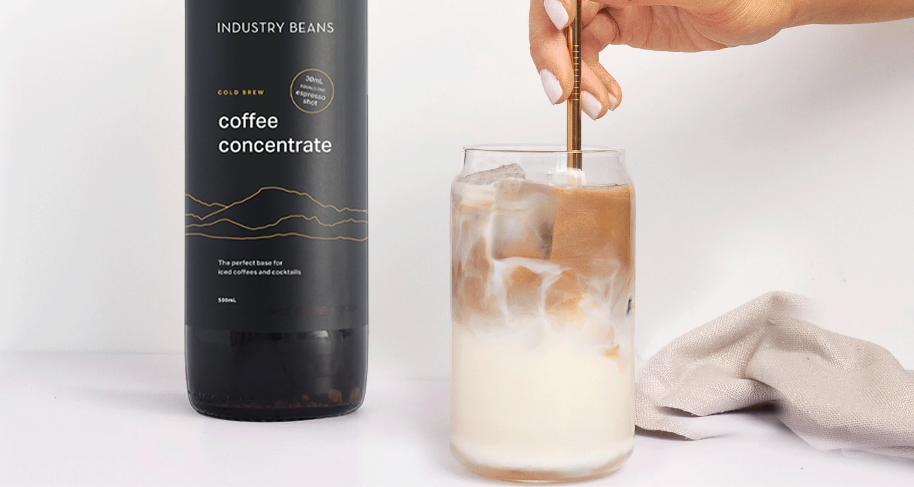 Person Stirring Cold Brew Concentrate Iced Coffee