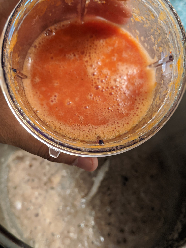 Showcasing the tomato and SpiceFix spice puree for the recipe 