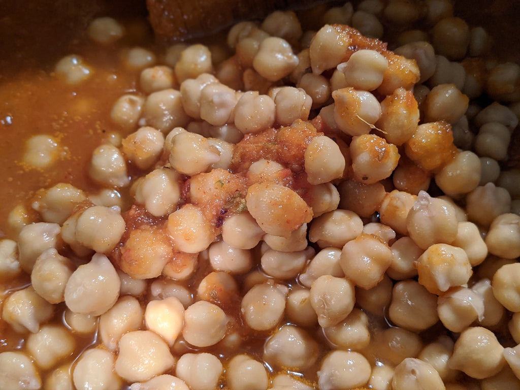 The chick peas are being added to the Instant Pot 