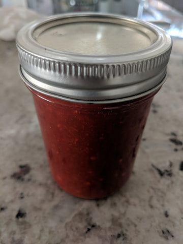 A jar with chili paste made with SpiceFix Kashmiri whole chilies 