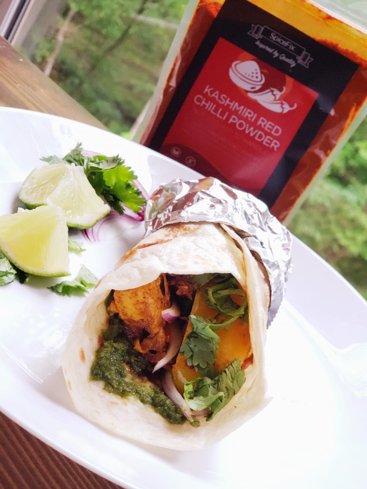 showcasing a delicious paneer/veggie kathi roll made using SpiceFix aromatic spices