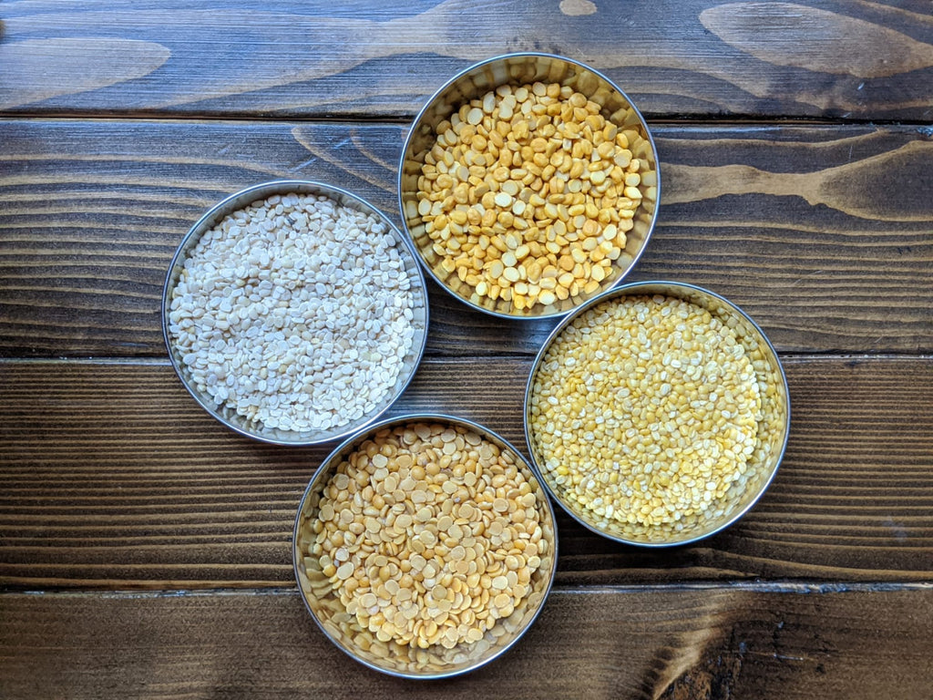 Display of bowls containing different lentils - Chana daal, Urad Daal, Toor Daal 