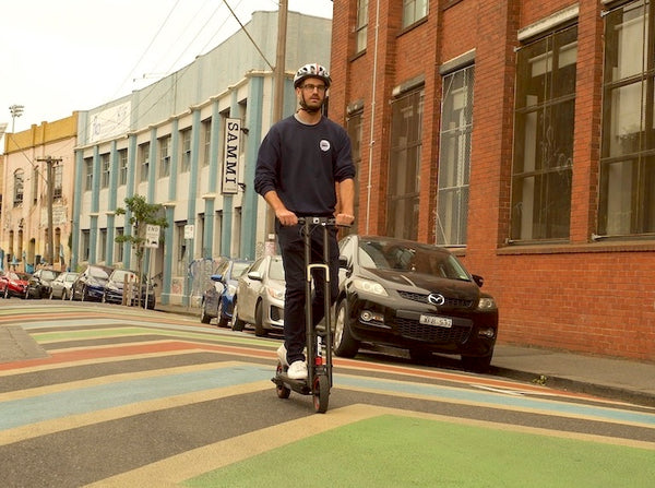 Man riding electric scooter City