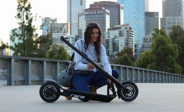 Woman opening foldable electric scooter