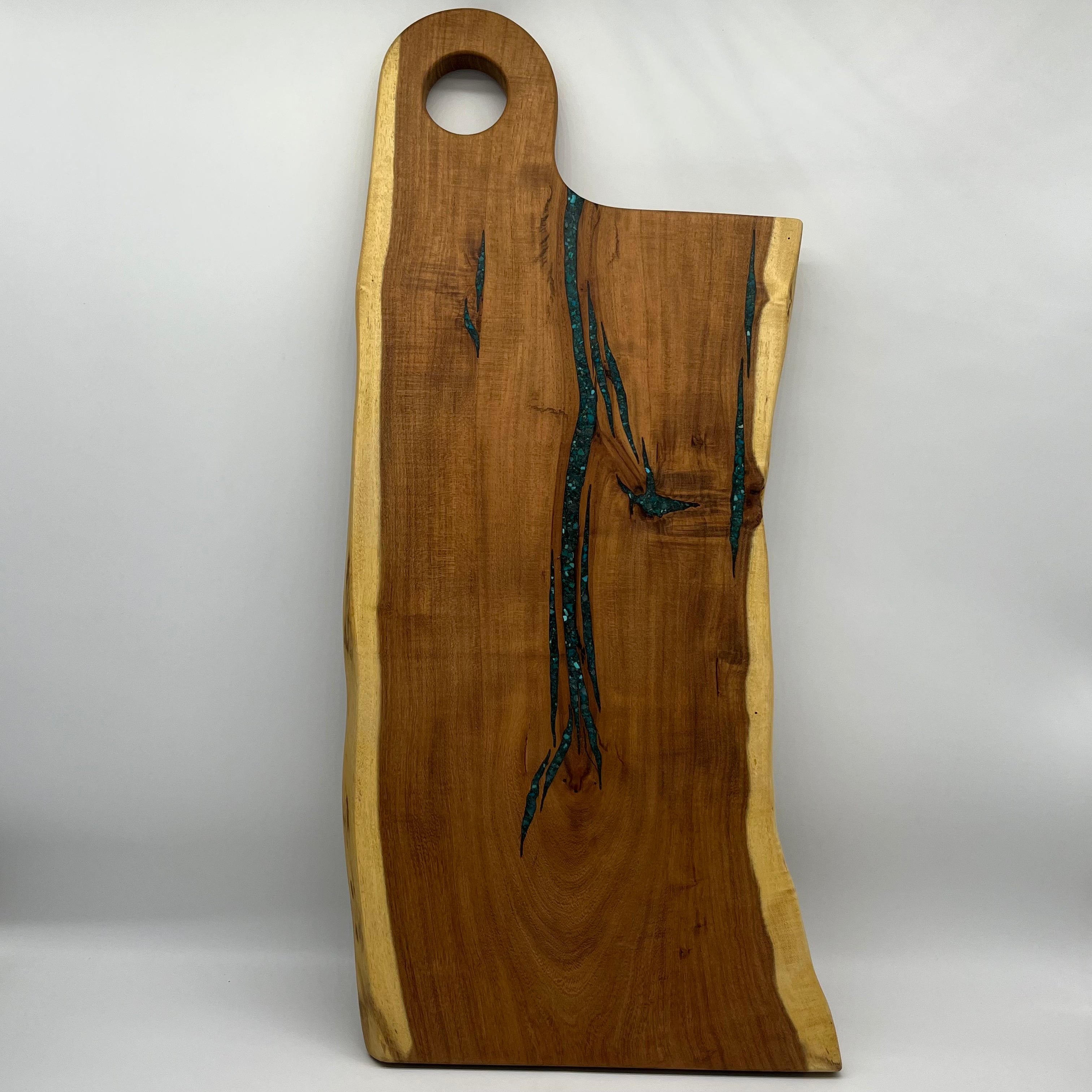 Cutting board with handle