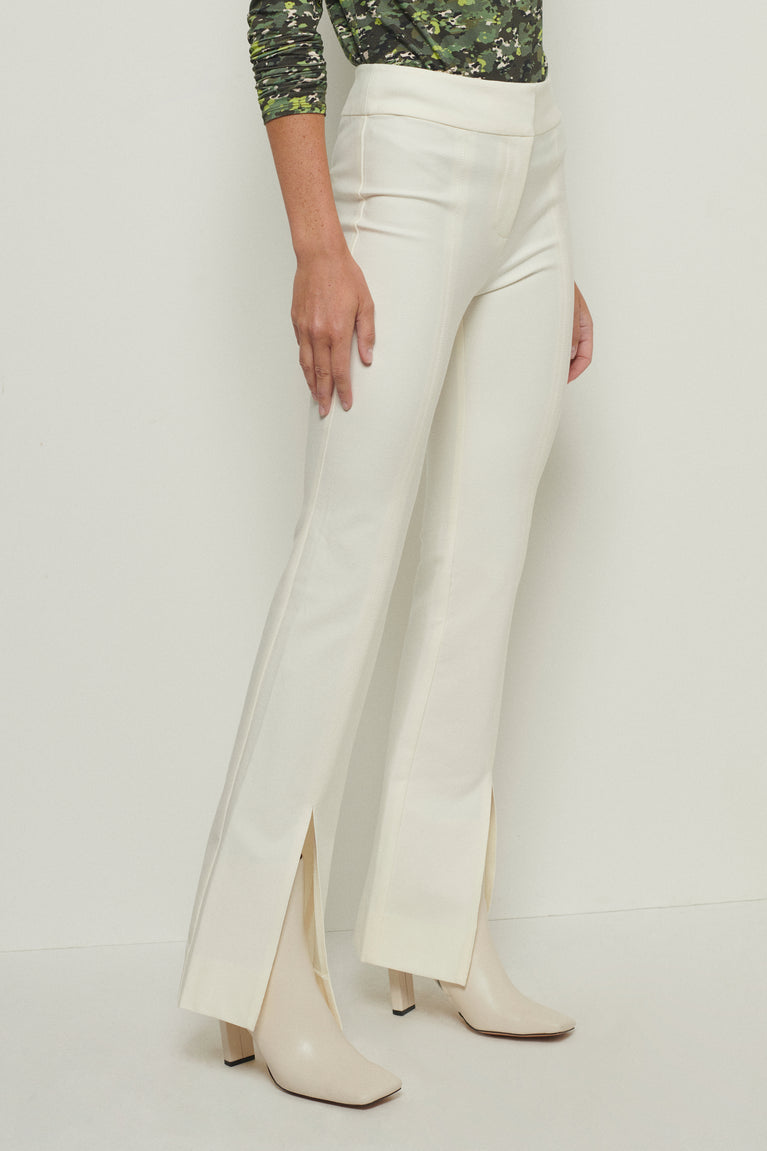 High-waist pants with wide leg and front slits in white