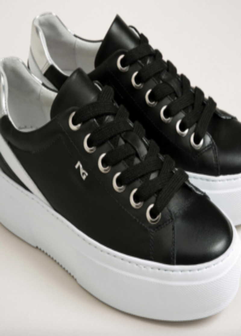 black trainers with white stripe